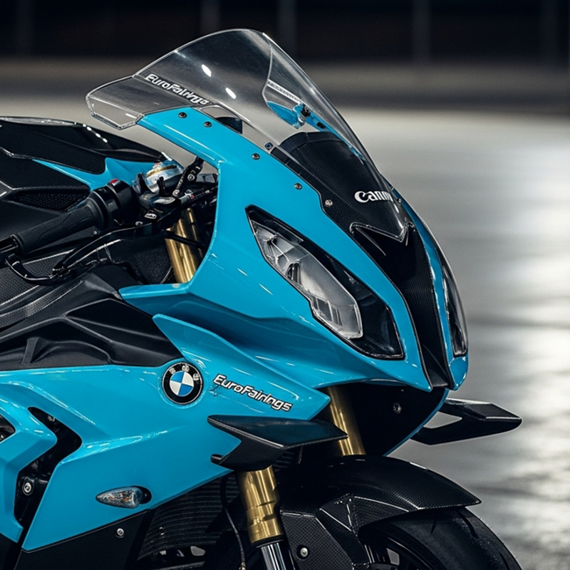 Close-up of a blue motorcycle with visible branding on a blurred background